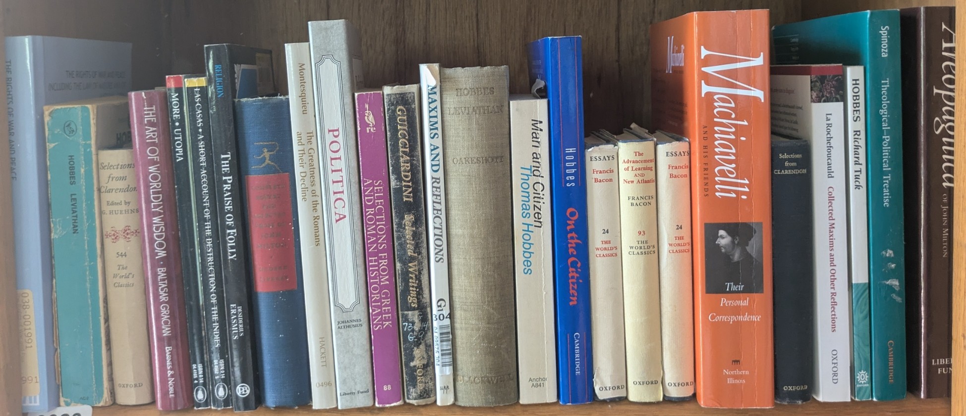Photograph of Shelf 23 with readable book spines.