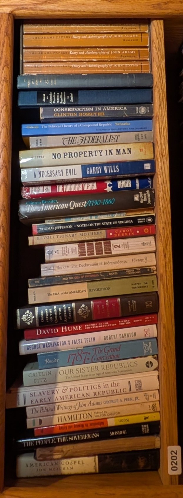 Books on Shelf 202, shown sideways to include the entire shelf