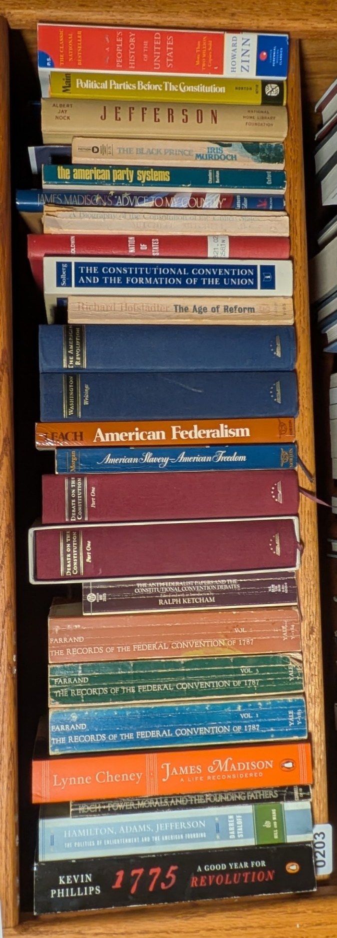 Books on Shelf 203, shown sideways to include the entire shelf