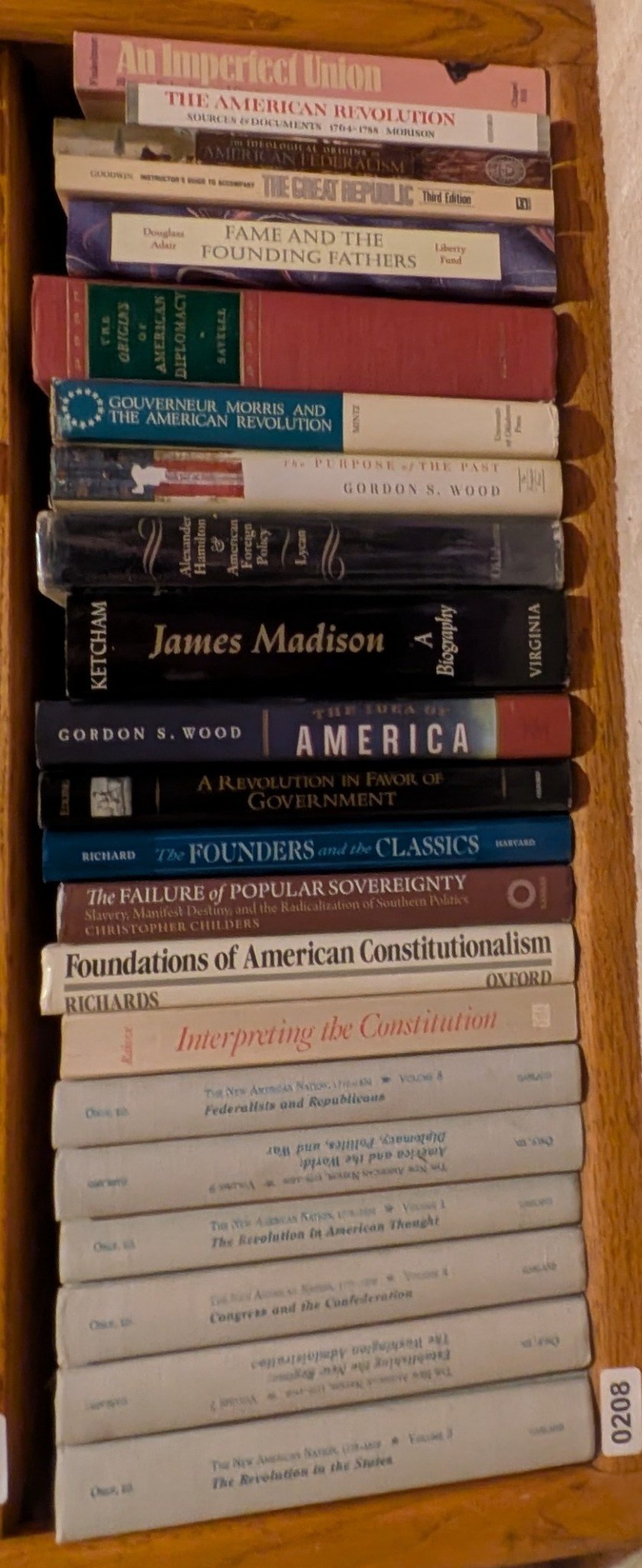 Books on Shelf 208, shown sideways to include the entire shelf