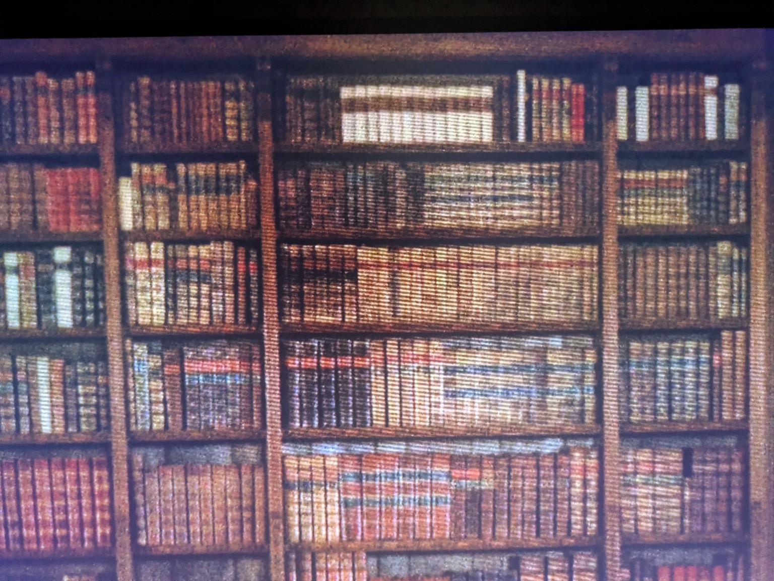Rows of leather-bound books on wooden shelves in Barry Lyndon