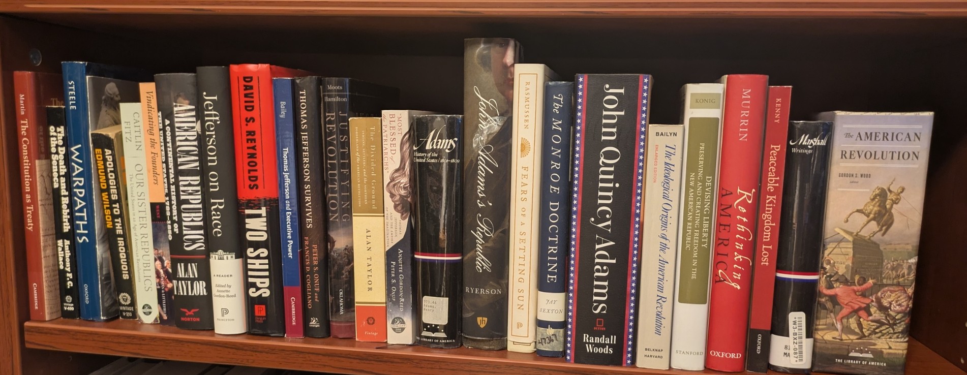 Photograph of Shelf 20A; books are listed in top-to-bottom order alongside the photograph.
