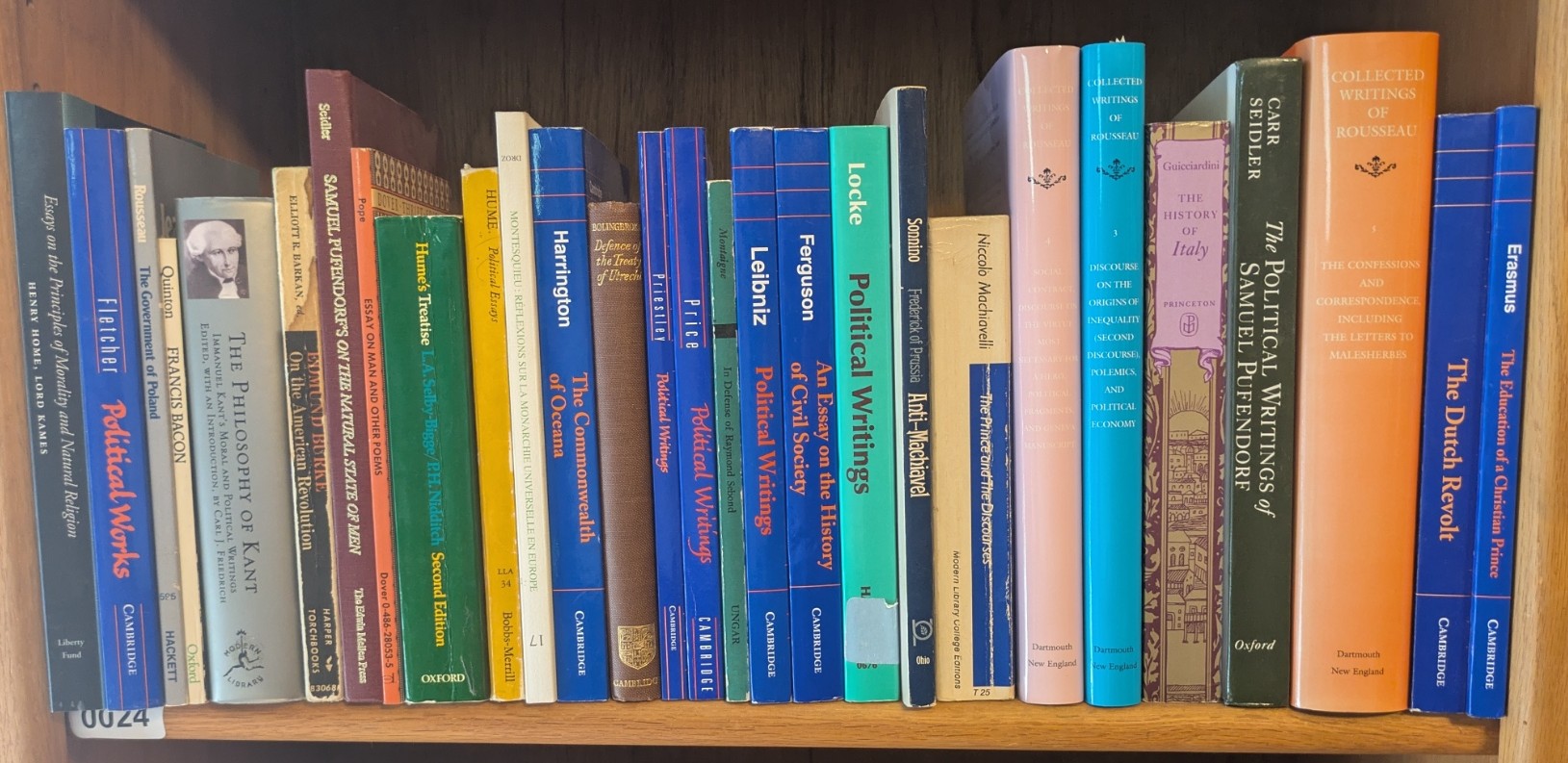 Photograph of Shelf 24 with readable book spines.