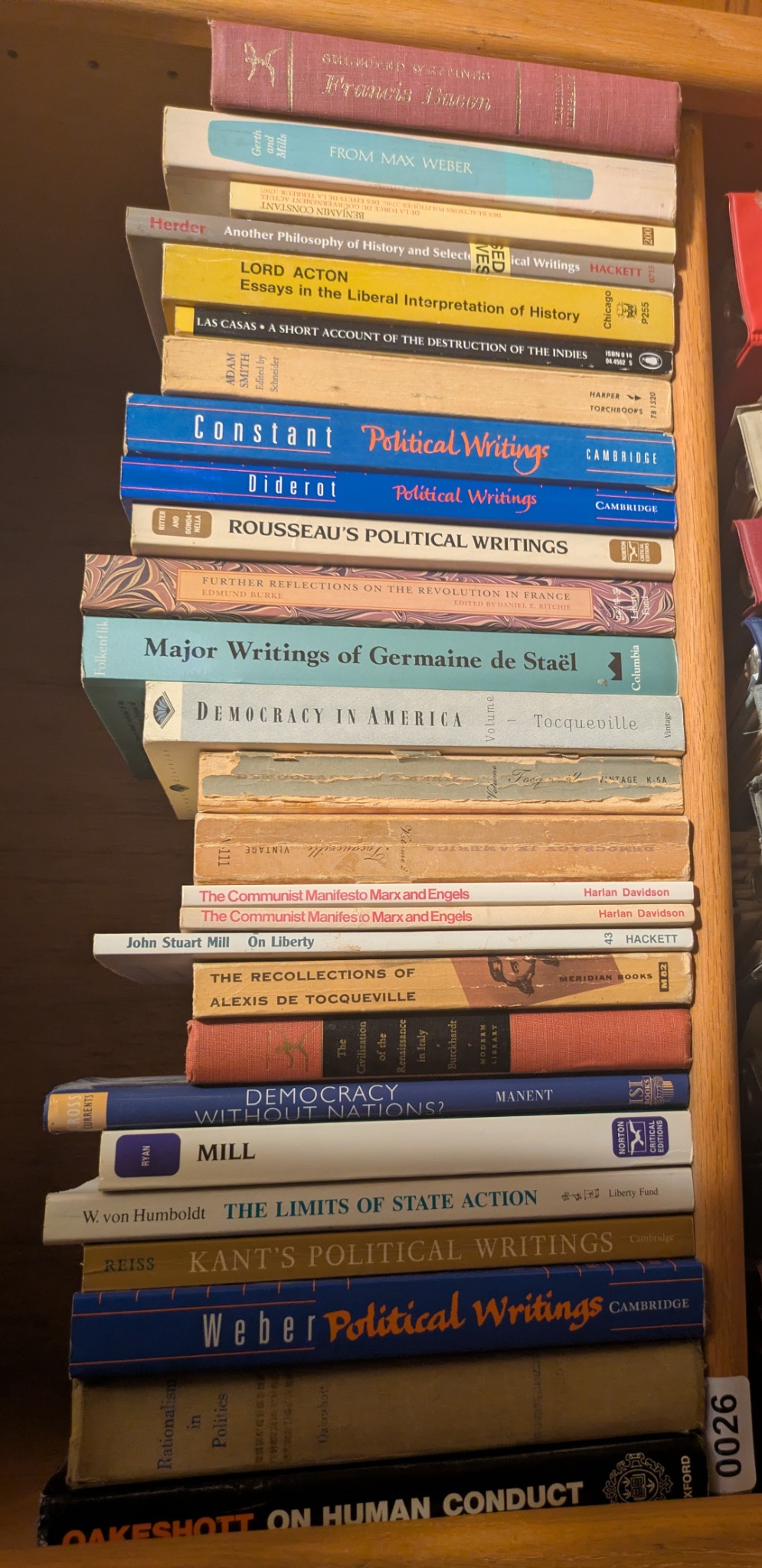 Photograph of Shelf 26 with readable book spines.