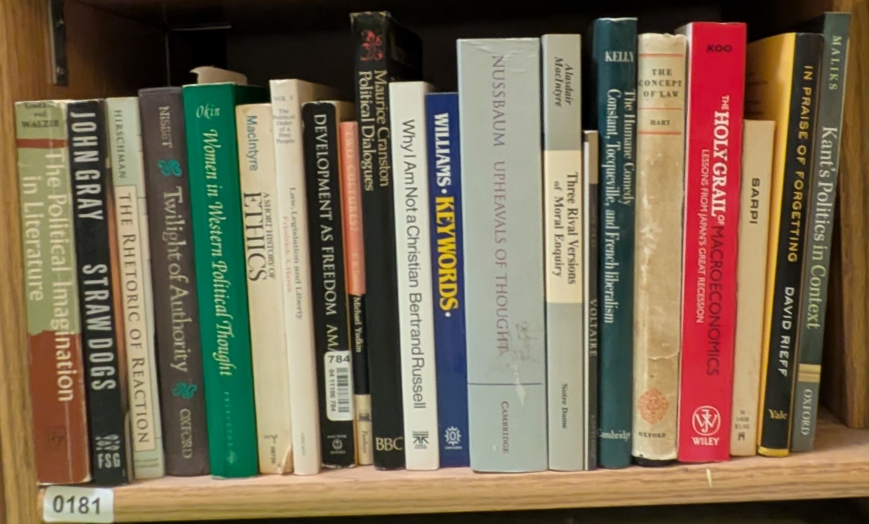 Photograph of Shelf 181 with readable book spines.