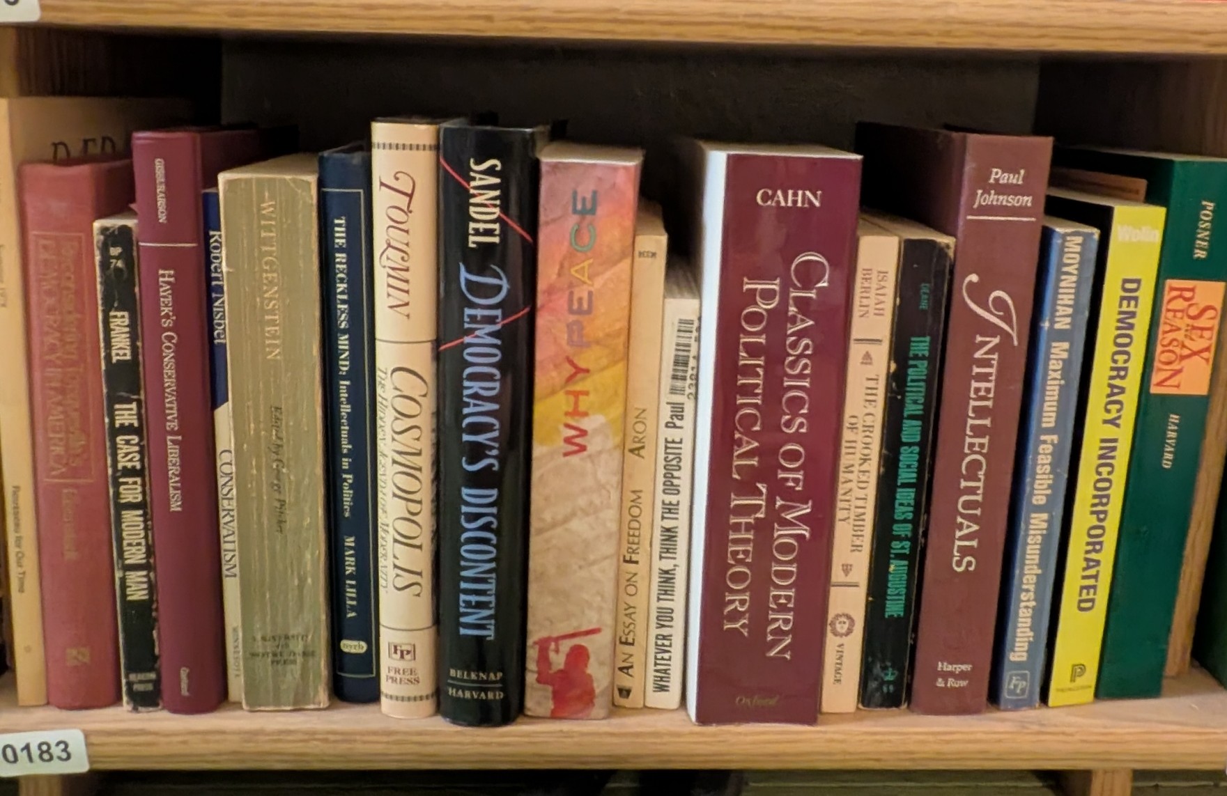 Photograph of Shelf 183 with readable book spines.
