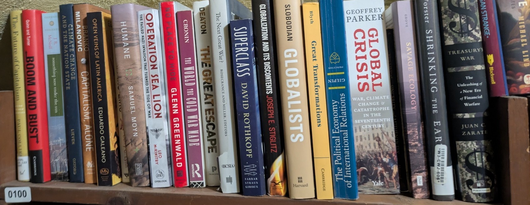 Photograph of Shelf 100; books are listed in top-to-bottom order alongside the photograph.