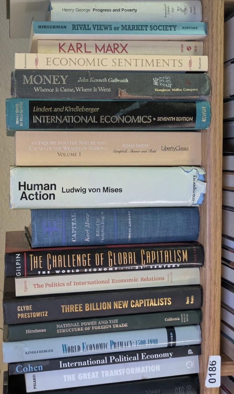 Photograph of Shelf 186; books are listed in top-to-bottom order alongside the photograph.