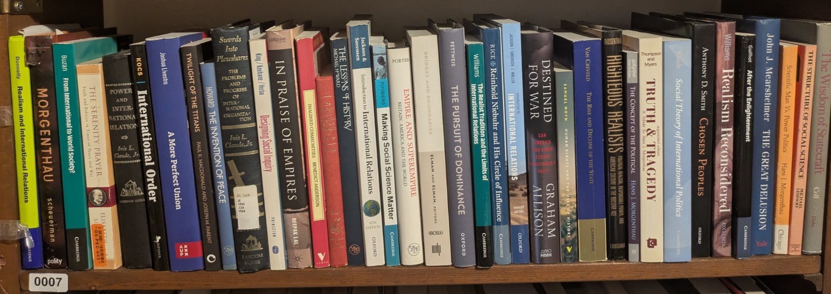 Photograph of Shelf 7; books are listed in top-to-bottom order alongside the photograph.