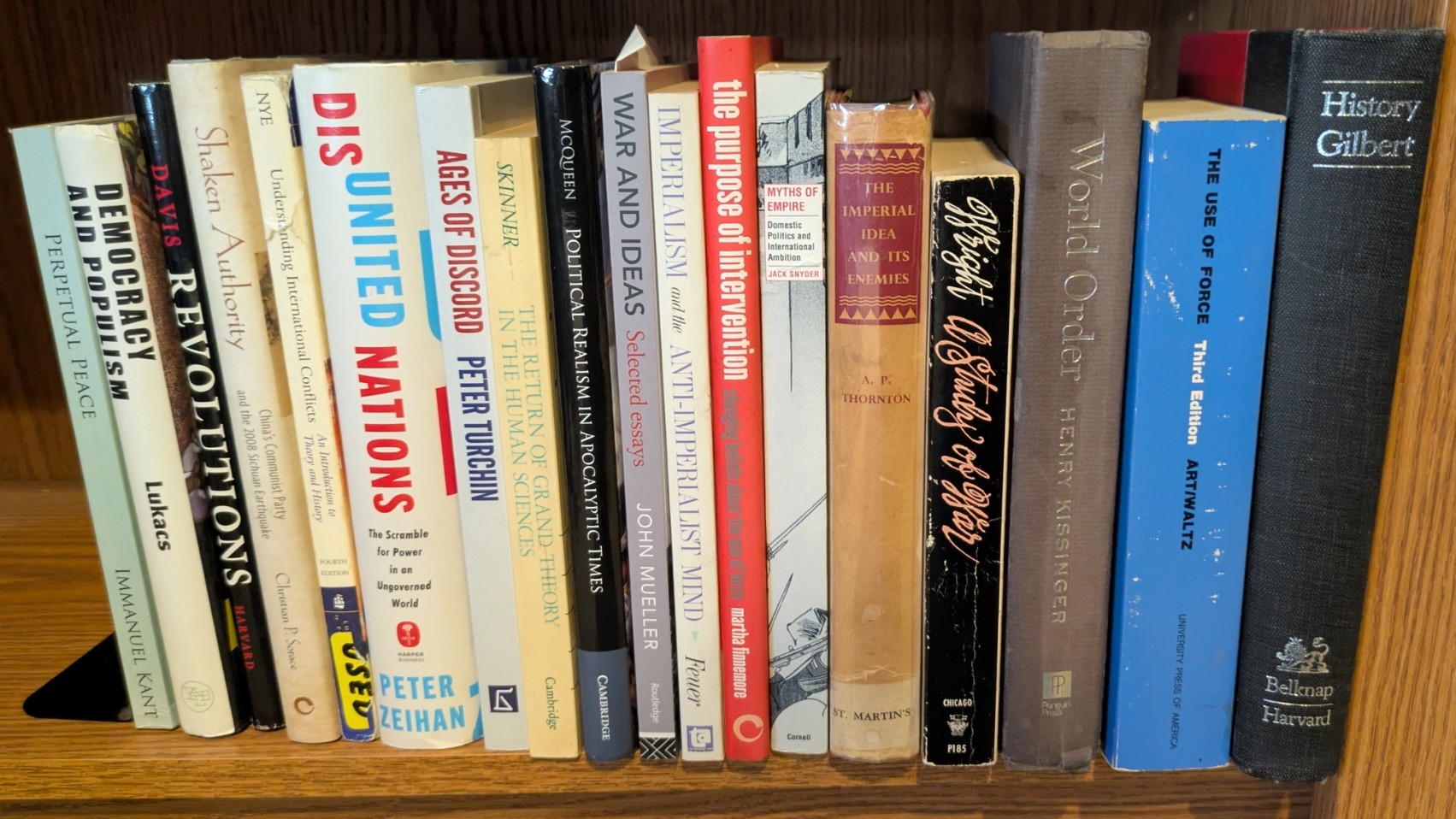 Photograph of Shelf 145; books are listed in top-to-bottom order alongside the photograph.