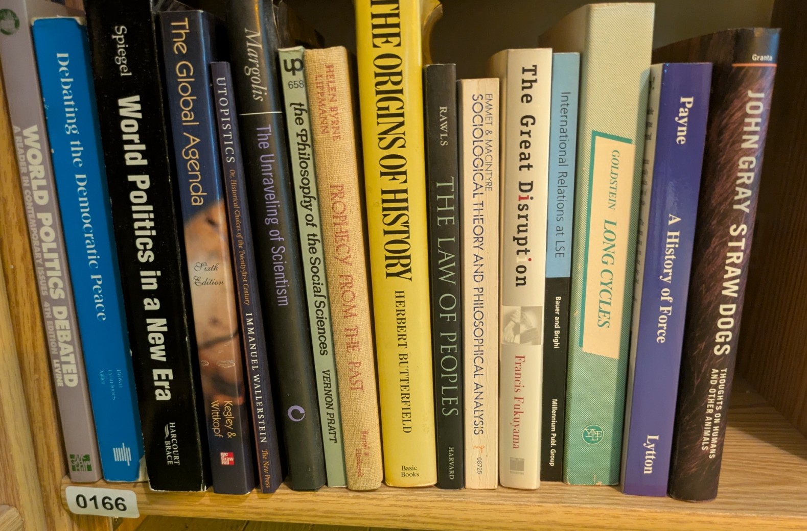 Photograph of Shelf 166; books are listed in top-to-bottom order alongside the photograph.