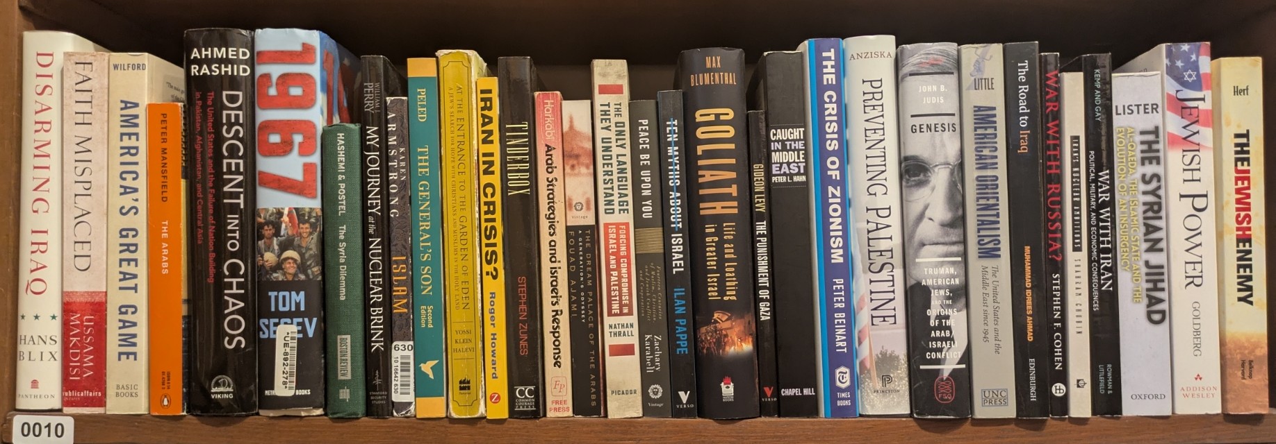 Photograph of Shelf 10; books are listed in top-to-bottom order alongside the photograph.