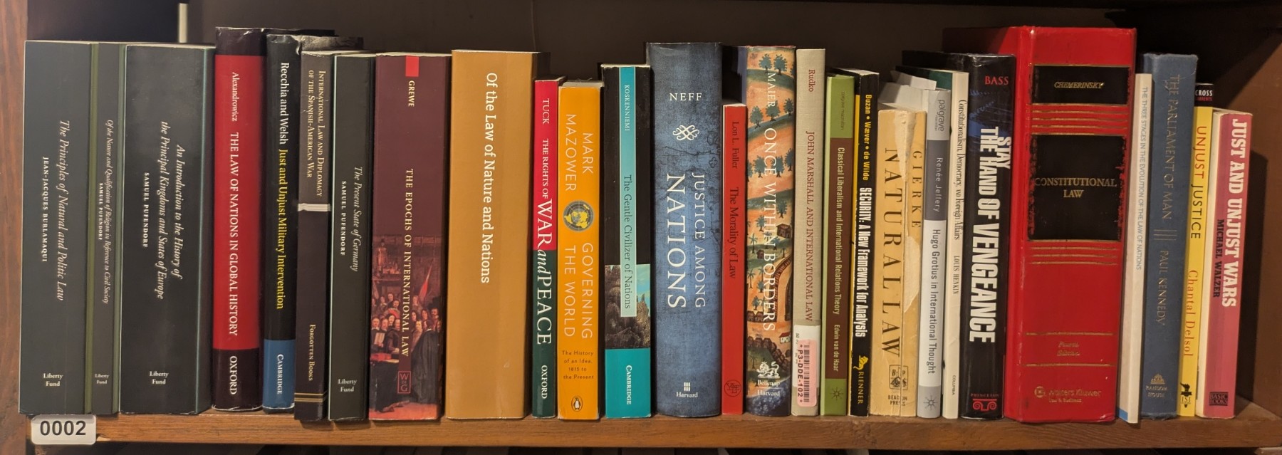 Photograph of Shelf 2; books are listed in top-to-bottom order alongside the photograph.