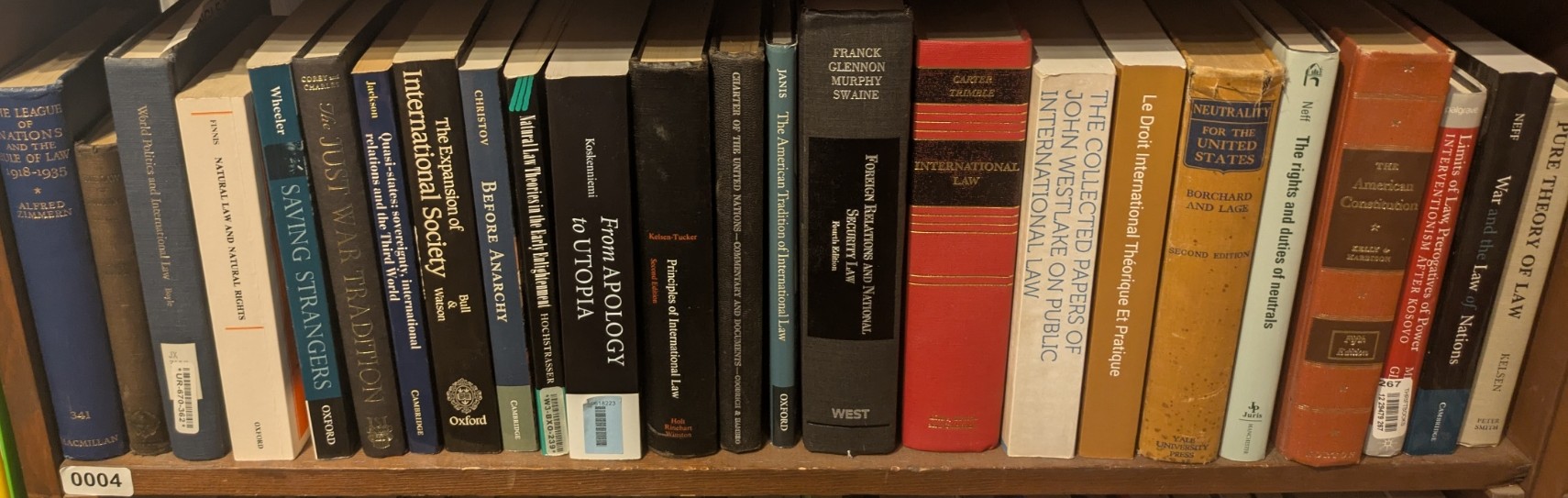 Photograph of Shelf 4; books are listed in top-to-bottom order alongside the photograph.