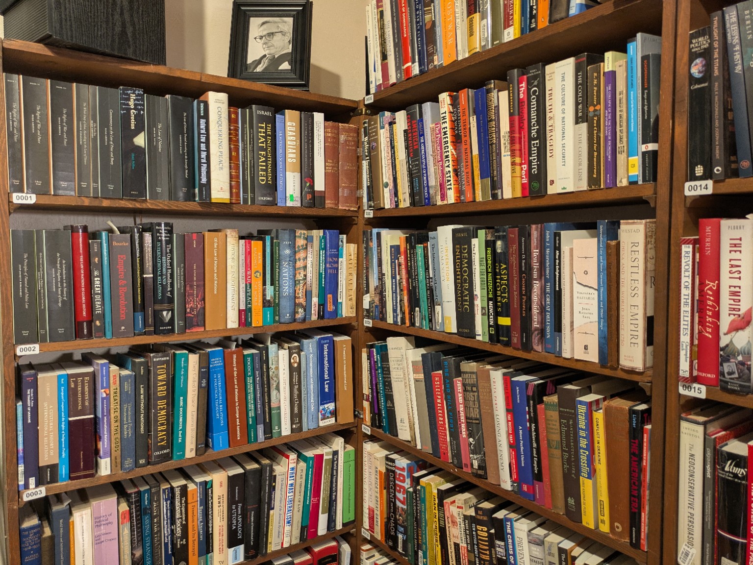 A corner of David Hendrickson’s library, with a portrait of Robert Tucker above the bookshelves