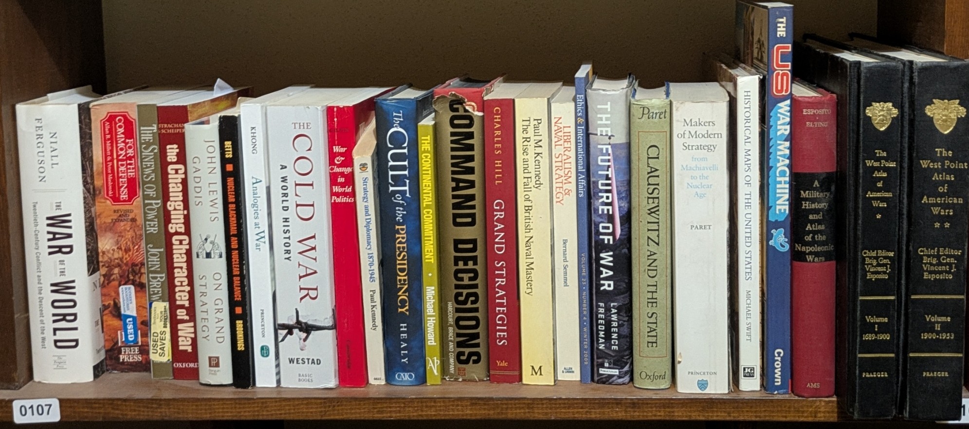 Photograph of Shelf 107; books are listed in top-to-bottom order alongside the photograph.