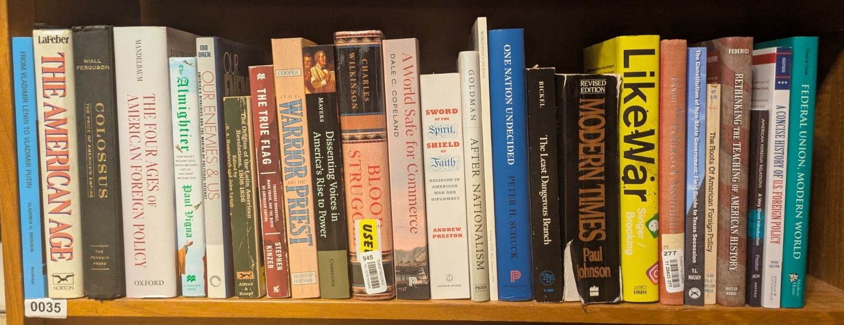 Photograph of Shelf 35; books are listed in top-to-bottom order alongside the photograph.