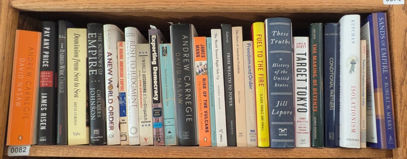 Photograph of Shelf 82; books are listed in top-to-bottom order alongside the photograph.