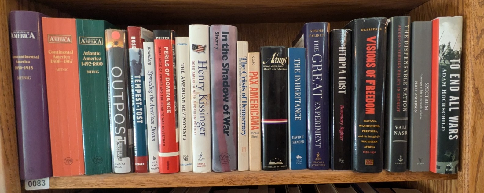 Photograph of Shelf 83; books are listed in top-to-bottom order alongside the photograph.