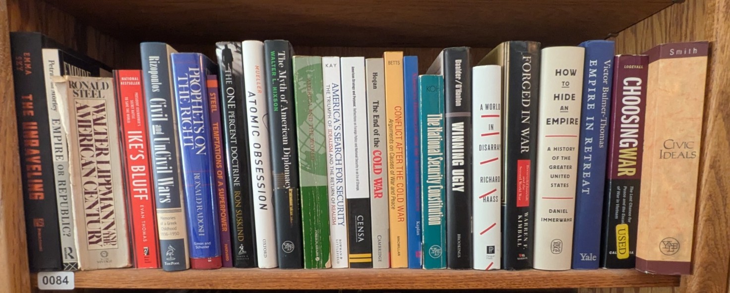 Photograph of Shelf 84; books are listed in top-to-bottom order alongside the photograph.