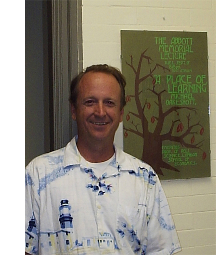 David C. Hendrickson beside an Oakeshott lecture poster at about age fifty